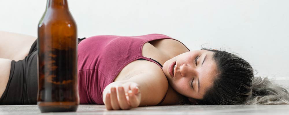 Drunk woman sleeping on the floor