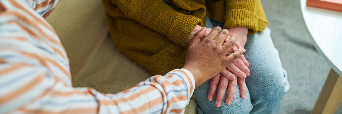 Therapy comforting sad woman